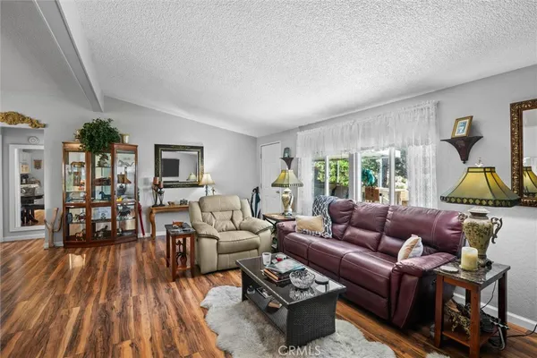 a large kitchen with stainless steel appliances a large counter top