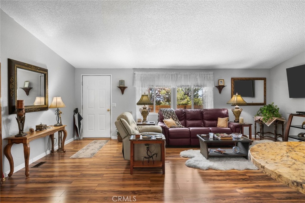 35109 Highway 79, Unit 116 Warner Springs, CA 92086 - Photo 23 of 72 a living room with furniture wooden floor and a flat screen tv