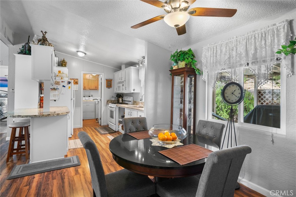 35109 Highway 79, Unit 116 Warner Springs, CA 92086 - Photo 26 of 72 a view of a dining room with furniture window and wooden floor