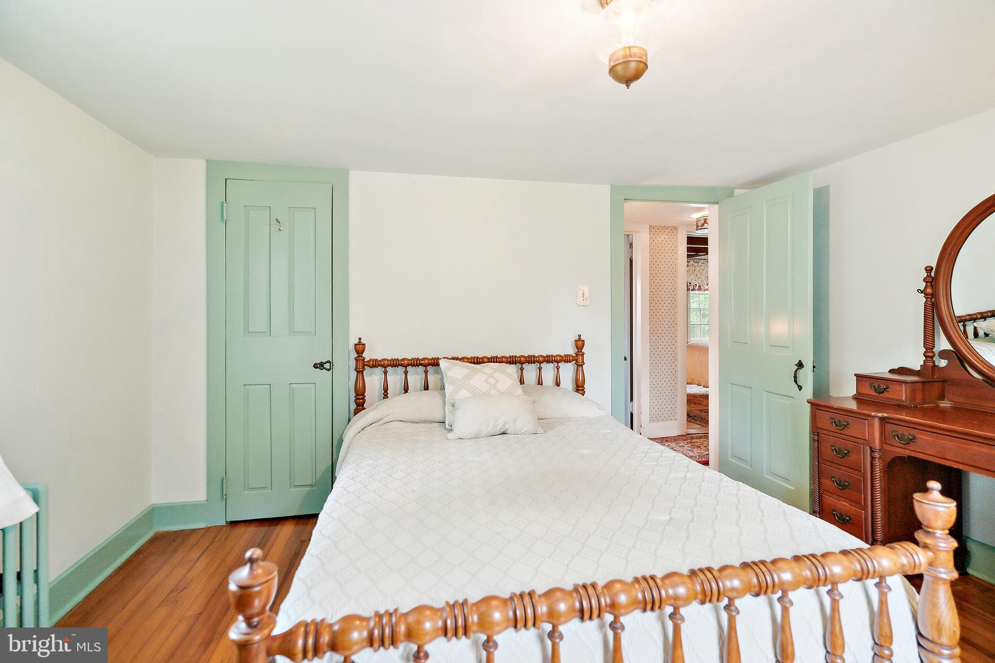 1132 Upper Stump Road Chalfont, PA 18914 - Photo 54 of 68 a bedroom with a bed and wooden floor