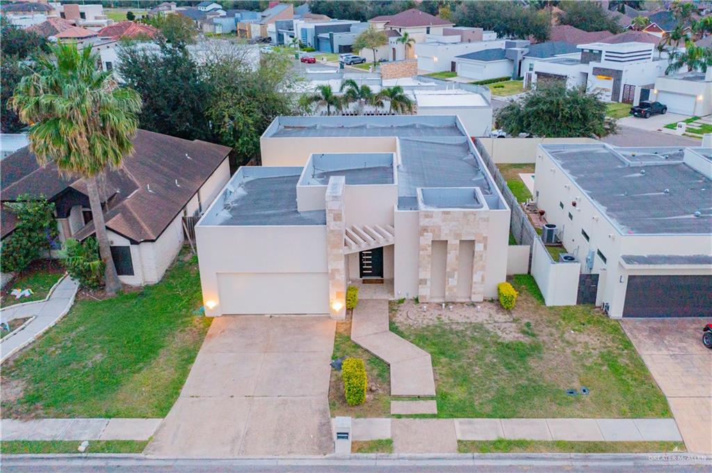 206 North Mockingbird Avenue Mission, TX 78572 - Photo 3 of 22 an aerial view of multiple houses with yard
