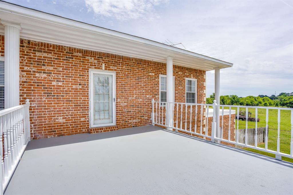 807 Caddo Road Joshua, TX 76058 - Photo 26 of 40 balcony off the upstairs primary bedroom