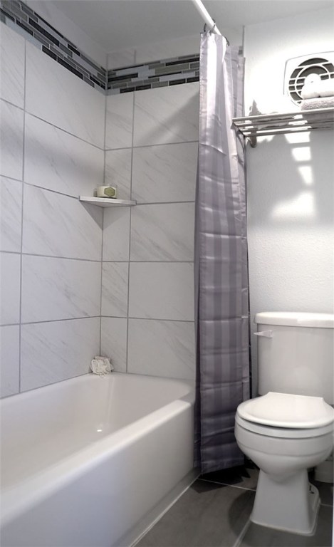 1212 Guadalupe Street, Unit 402 Austin, TX 78701 - Photo 12 of 20 a bathroom with a toilet and shower