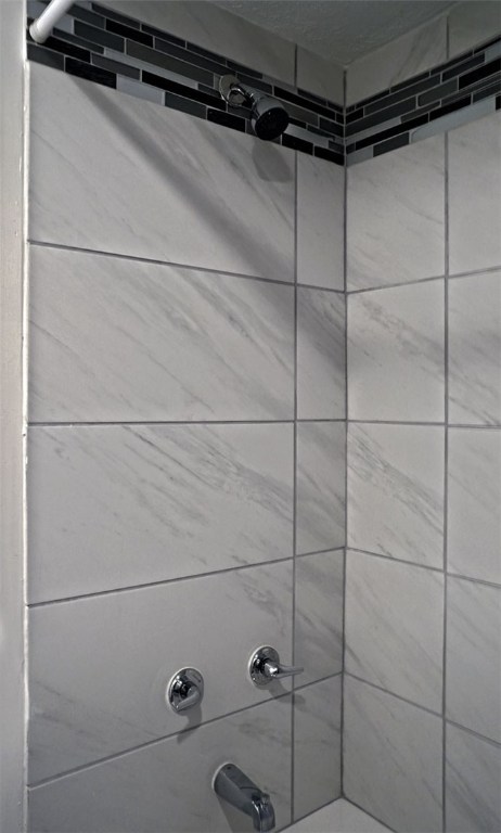 1212 Guadalupe Street, Unit 402 Austin, TX 78701 - Photo 13 of 20 a close view of a shower