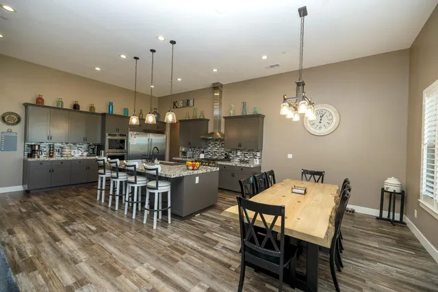 a kitchen with sink stove and cabinets