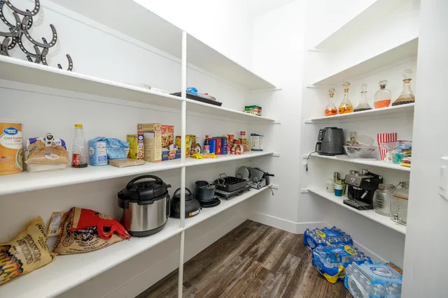 a living room with furniture a flat screen tv and a piano