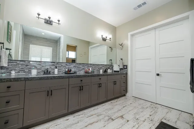 a bedroom with a bed and dresser