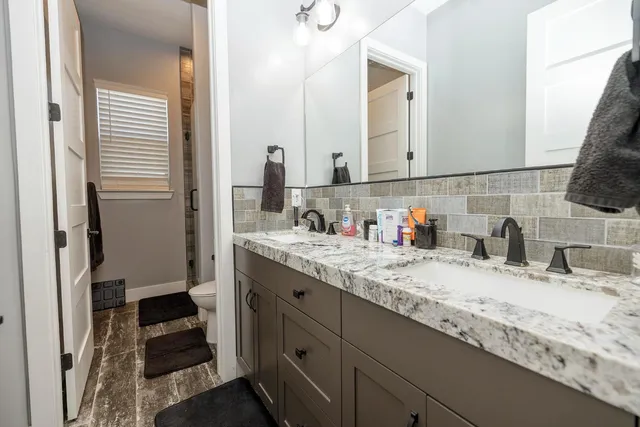 a bathroom with a sink and a mirror