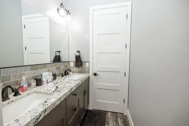 a bedroom with a bed and a desk