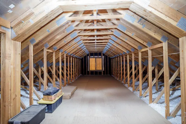 a house with trees in the background