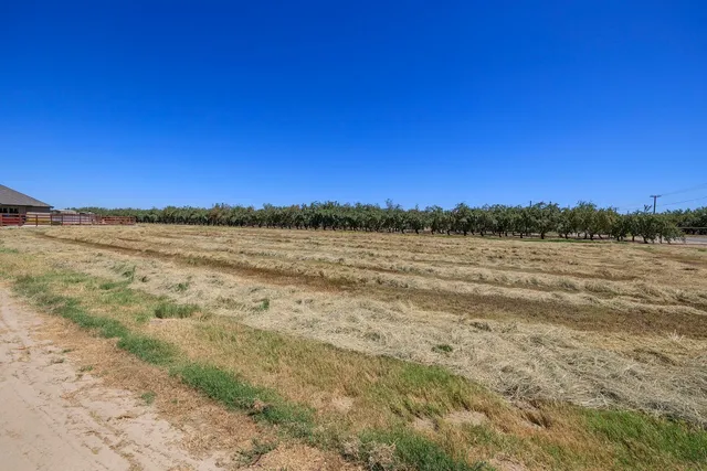 a view of a backyard with sitting area