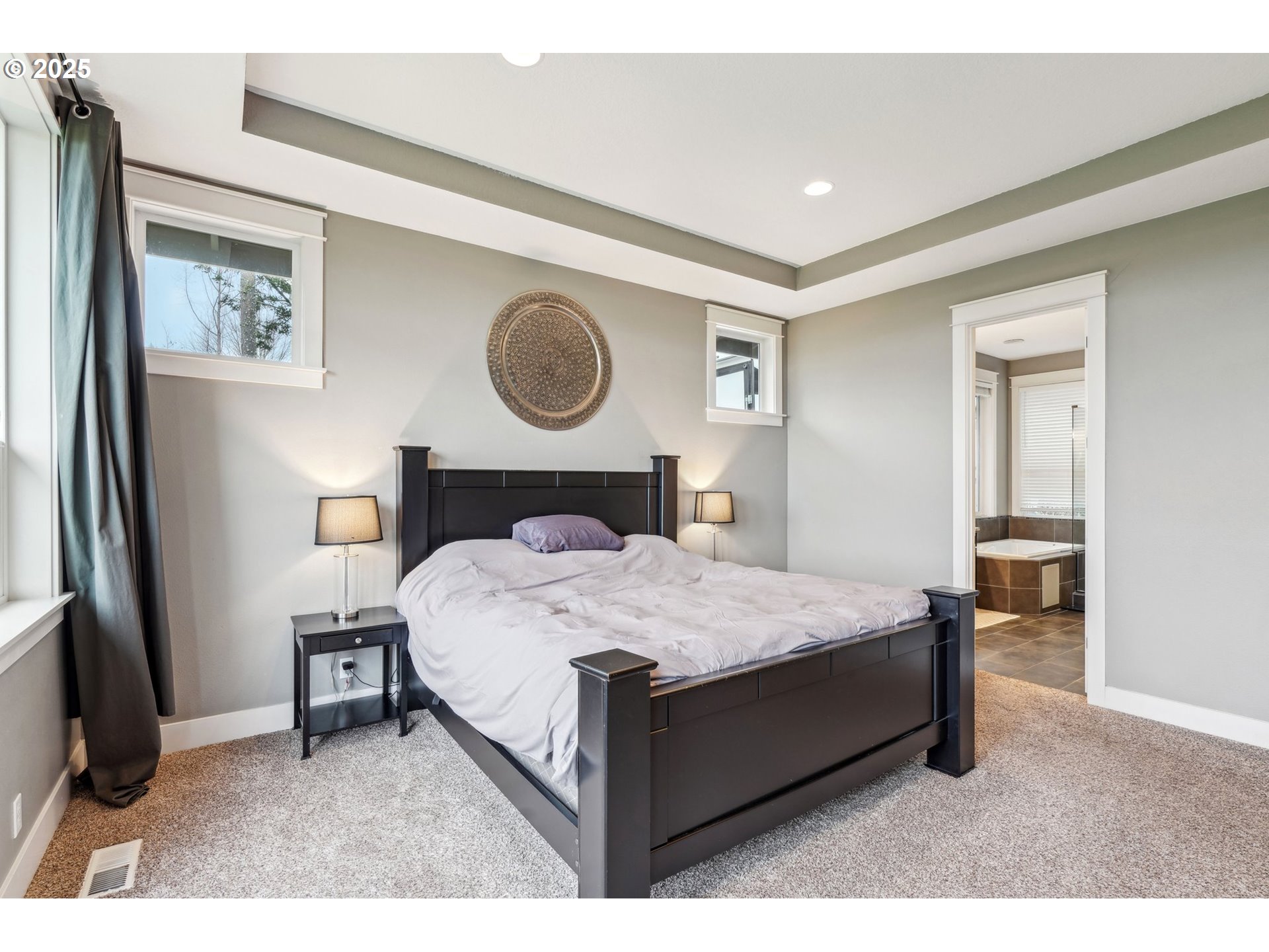 18147 Southeast Troge Road Damascus, OR 97089 - Photo 16 of 45 a bedroom with a bed and a window