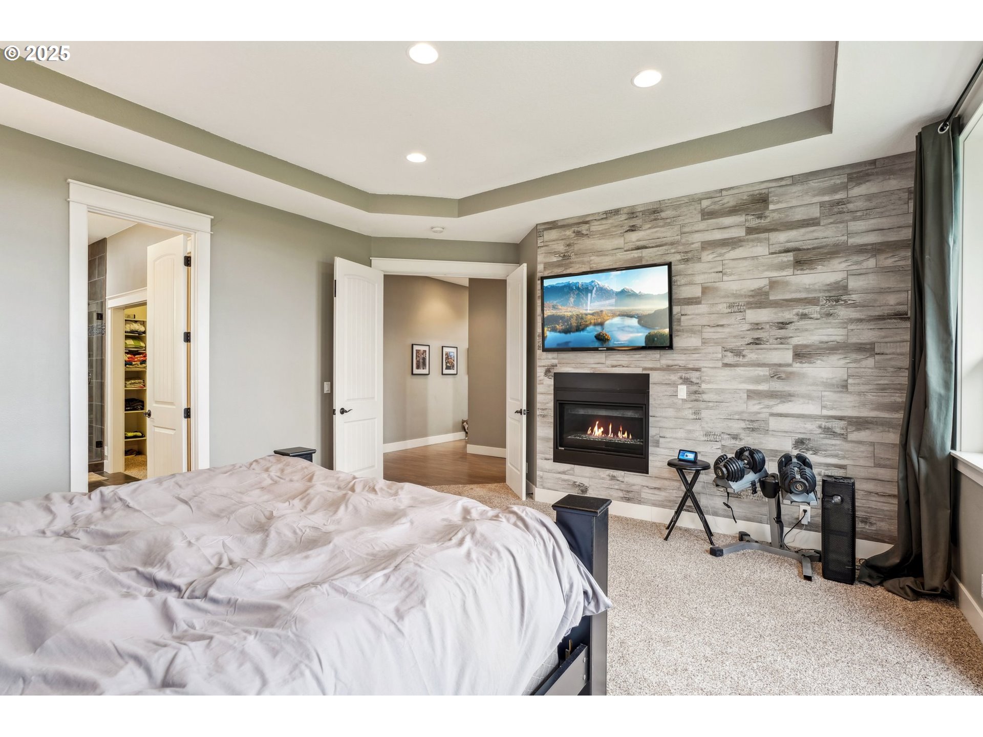18147 Southeast Troge Road Damascus, OR 97089 - Photo 19 of 45 a bed room with a bed and a fireplace