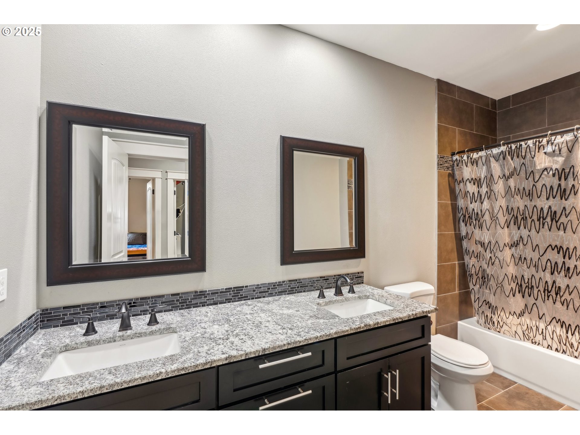 18147 Southeast Troge Road Damascus, OR 97089 - Photo 30 of 45 a bathroom with a granite countertop sink and a mirror