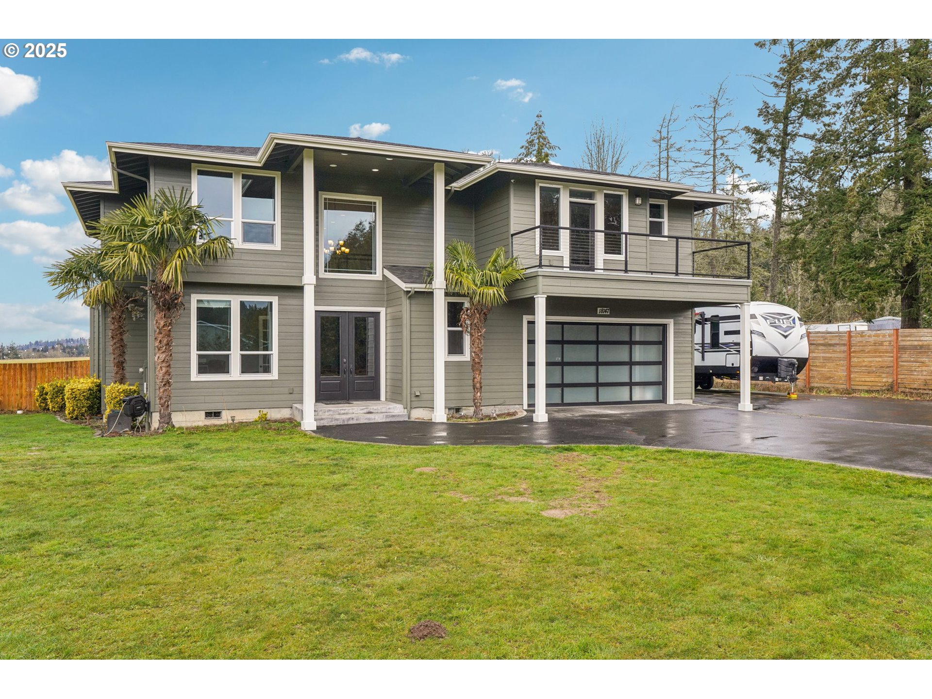 18147 Southeast Troge Road Damascus, OR 97089 - Photo 3 of 45 a front view of a house with a garden