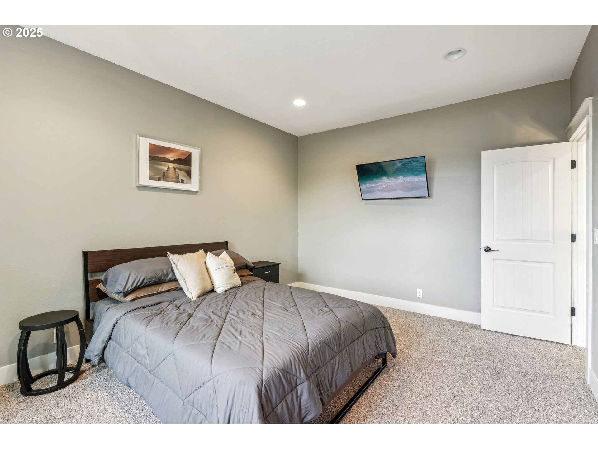18147 Southeast Troge Road Damascus, OR 97089 - Photo 33 of 45 a bedroom with a bed and a painting