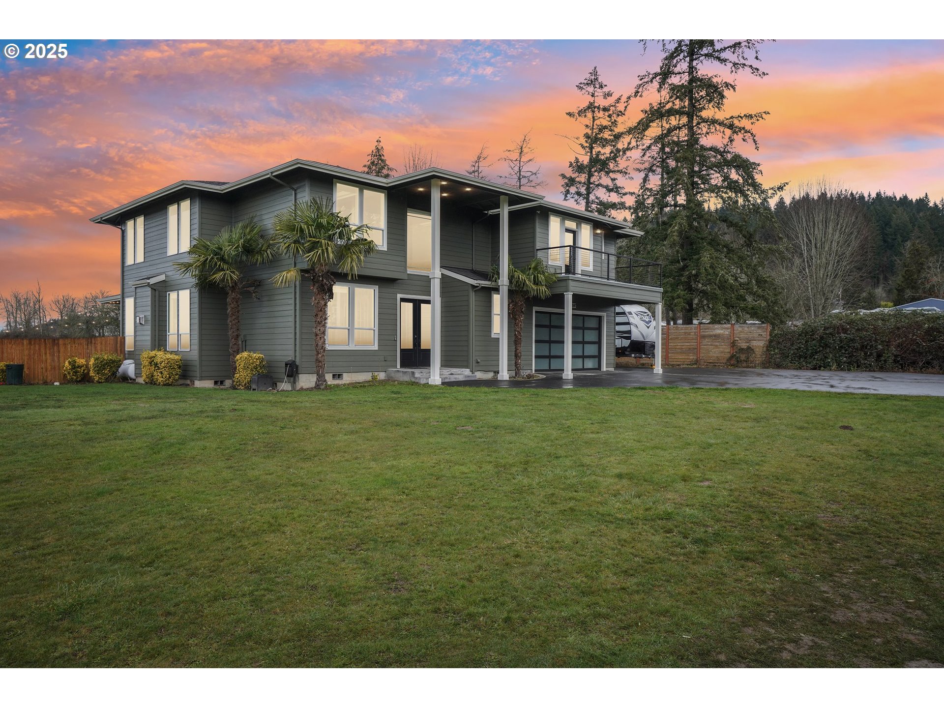 18147 Southeast Troge Road Damascus, OR 97089 - Photo 4 of 45 a front view of a house with a garden