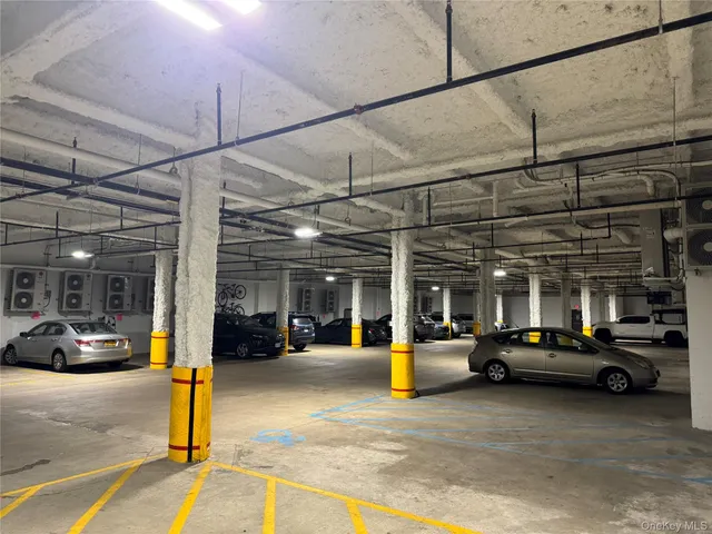 a view of parking area with parked cars