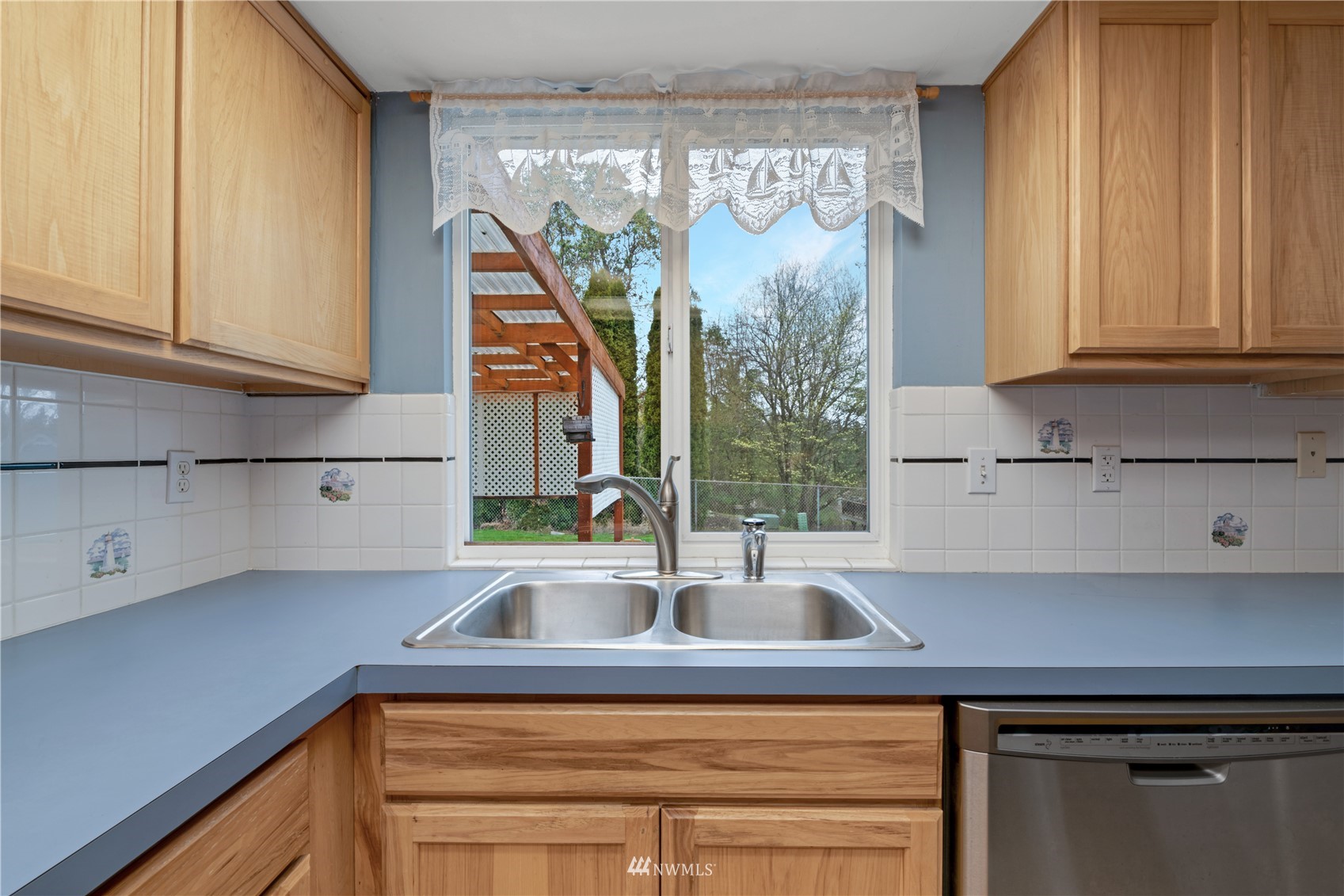 19 222nd Street Southwest Bothell, WA 98021 - Photo 8 of 29 a kitchen with a sink and a window