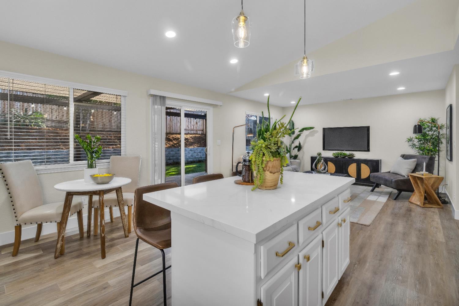 4711 Stuart Street Rocklin, CA 95765 - Photo 17 of 48 a view of a dining room with furniture window and wooden floor
