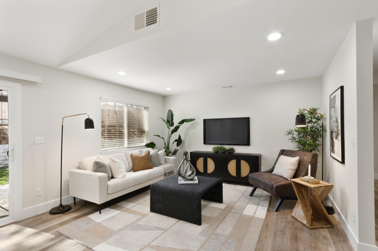 4711 Stuart Street Rocklin, CA 95765 - Photo 25 of 48 a living room with furniture and a flat screen tv