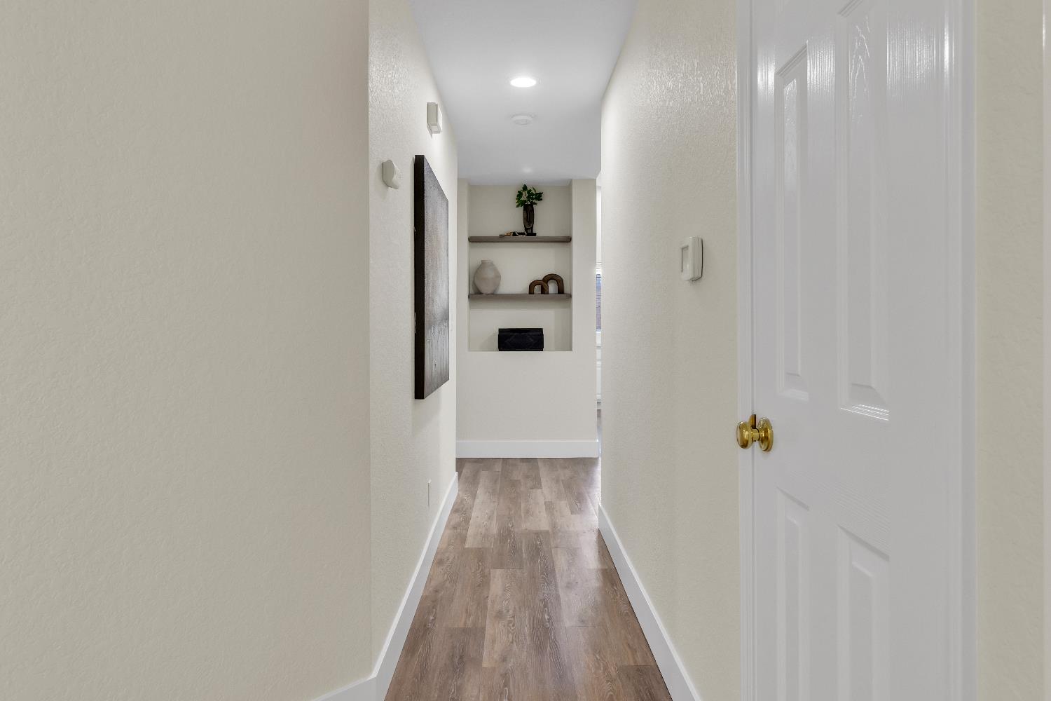 4711 Stuart Street Rocklin, CA 95765 - Photo 27 of 48 a view of a hallway with wooden floor