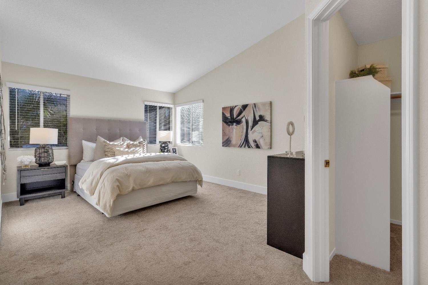 4711 Stuart Street Rocklin, CA 95765 - Photo 29 of 48 a bedroom with a bed and a painting on the wall