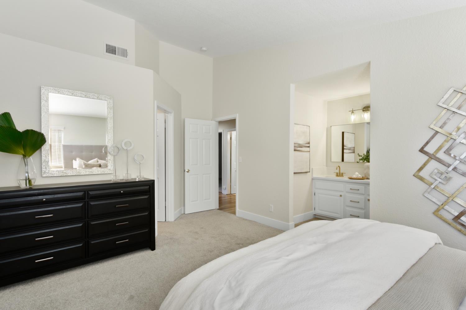 4711 Stuart Street Rocklin, CA 95765 - Photo 30 of 48 a bedroom with a bed and a dresser