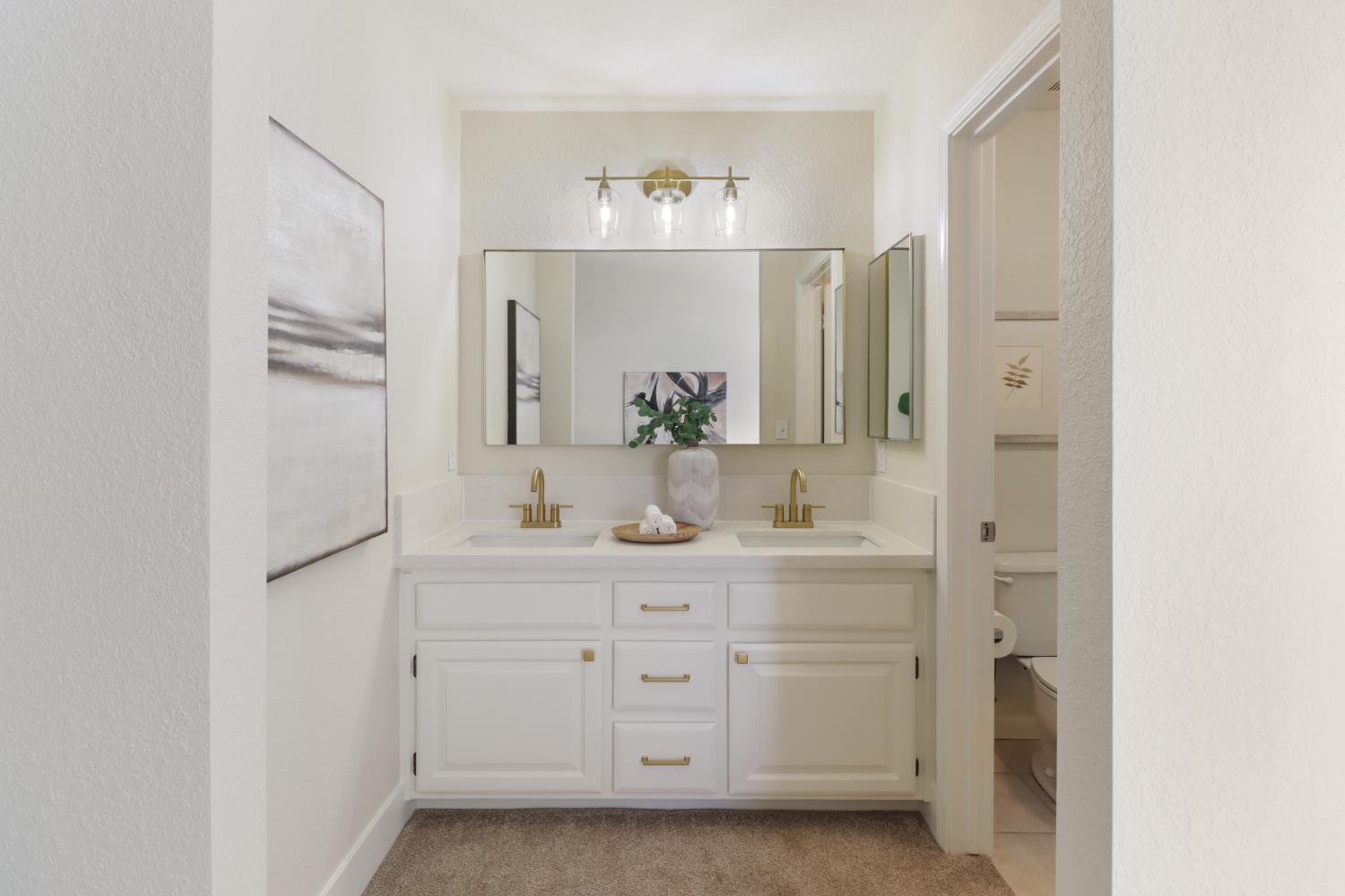 4711 Stuart Street Rocklin, CA 95765 - Photo 33 of 48 a bathroom with a double vanity sink and mirror