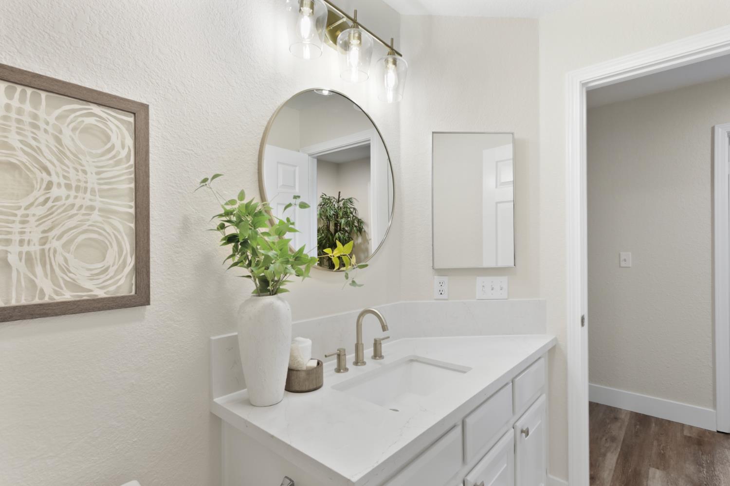 4711 Stuart Street Rocklin, CA 95765 - Photo 38 of 48 a bathroom with a sink a vanity and a mirror