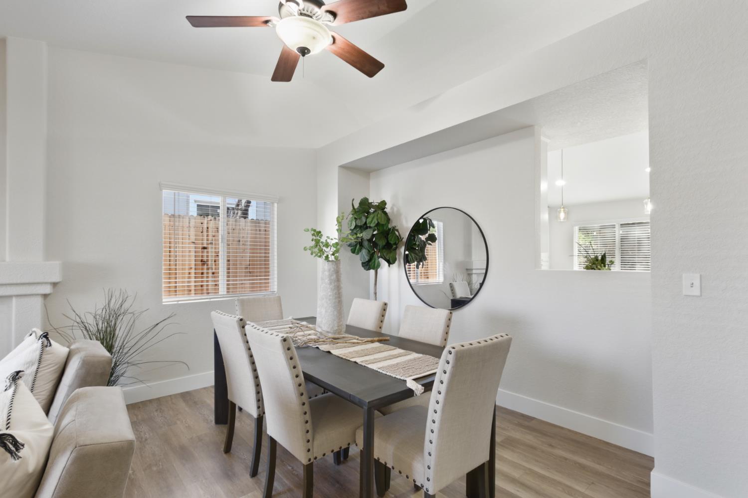 4711 Stuart Street Rocklin, CA 95765 - Photo 8 of 48 a view of a dining room with furniture window and wooden floor