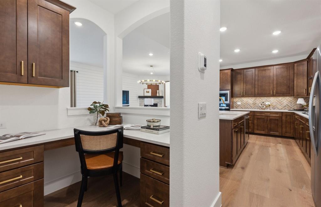 300 Brookhurst Road Little Elm, TX 75068 - Photo 5 of 20 a kitchen with a sink stainless steel appliances and cabinets