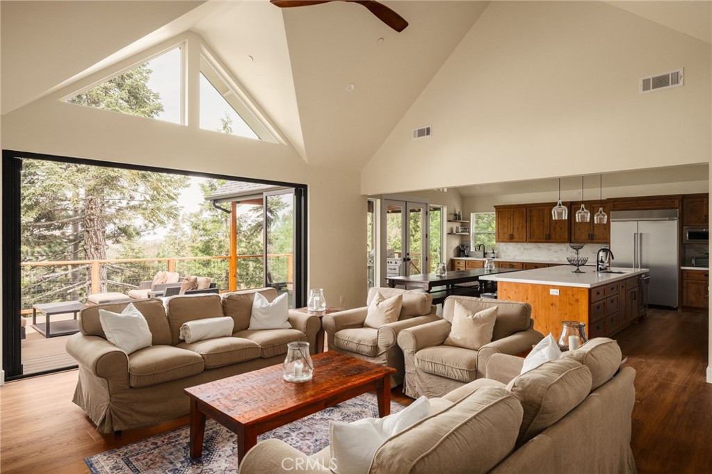 26910 Everest Road Lake Arrowhead, CA 92391 - Photo 3 of 15 living room to shutter door system