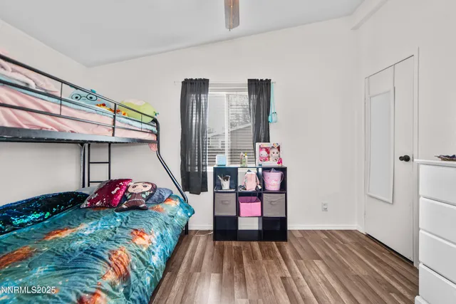 a bedroom with bed and walk in closet