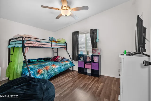 a bedroom with two beds and a dresser