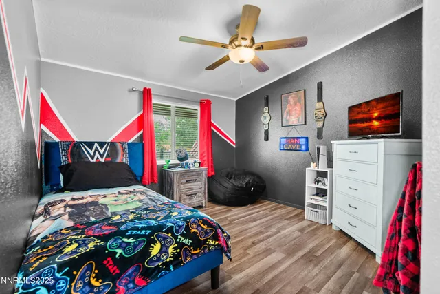 a bedroom with a bed and a dresser in it