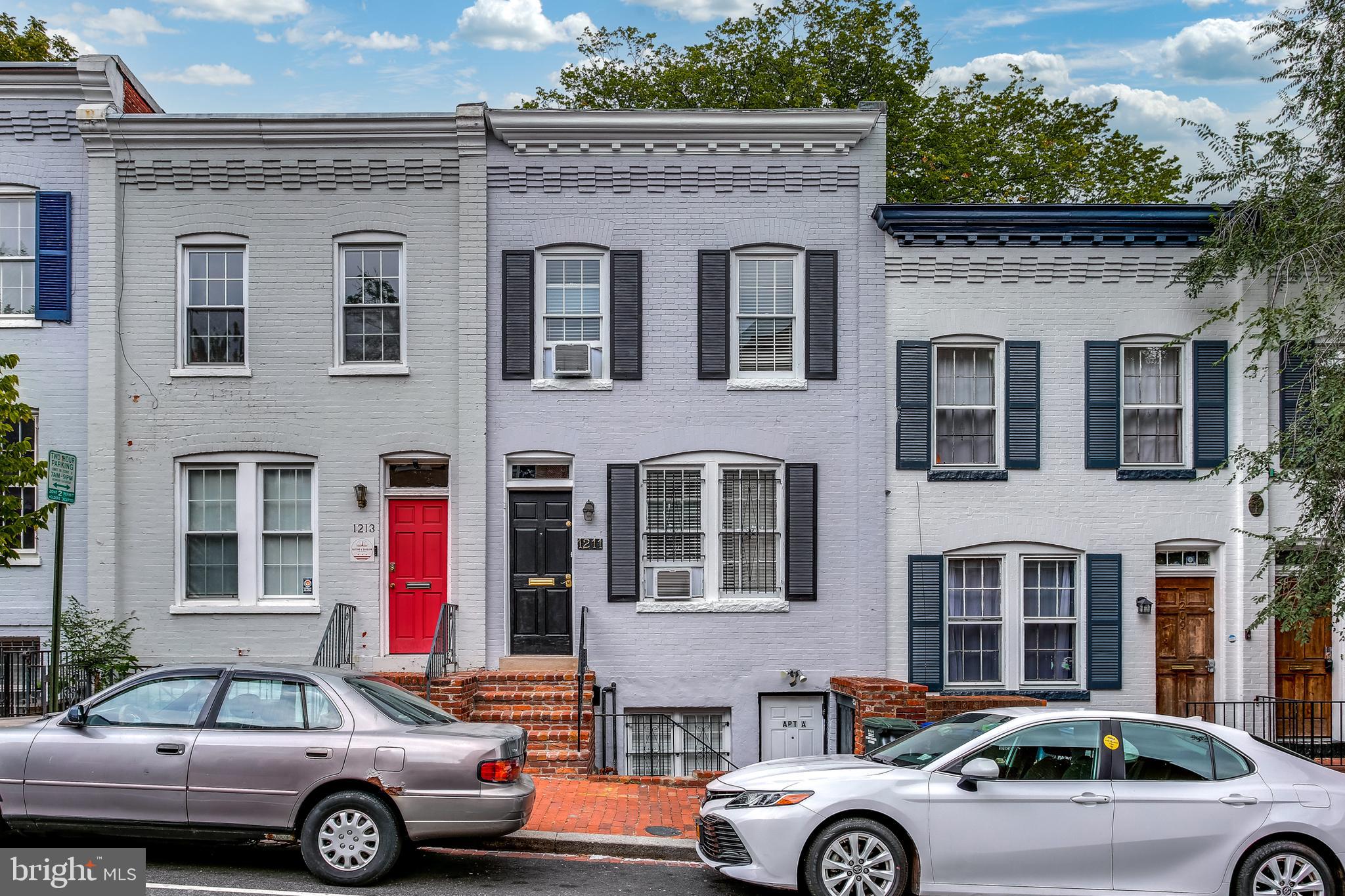 1211 33rd Street Northwest, Unit 2 Washington, DC 20007 - Photo 1 of 23 a front view of a house with parking space