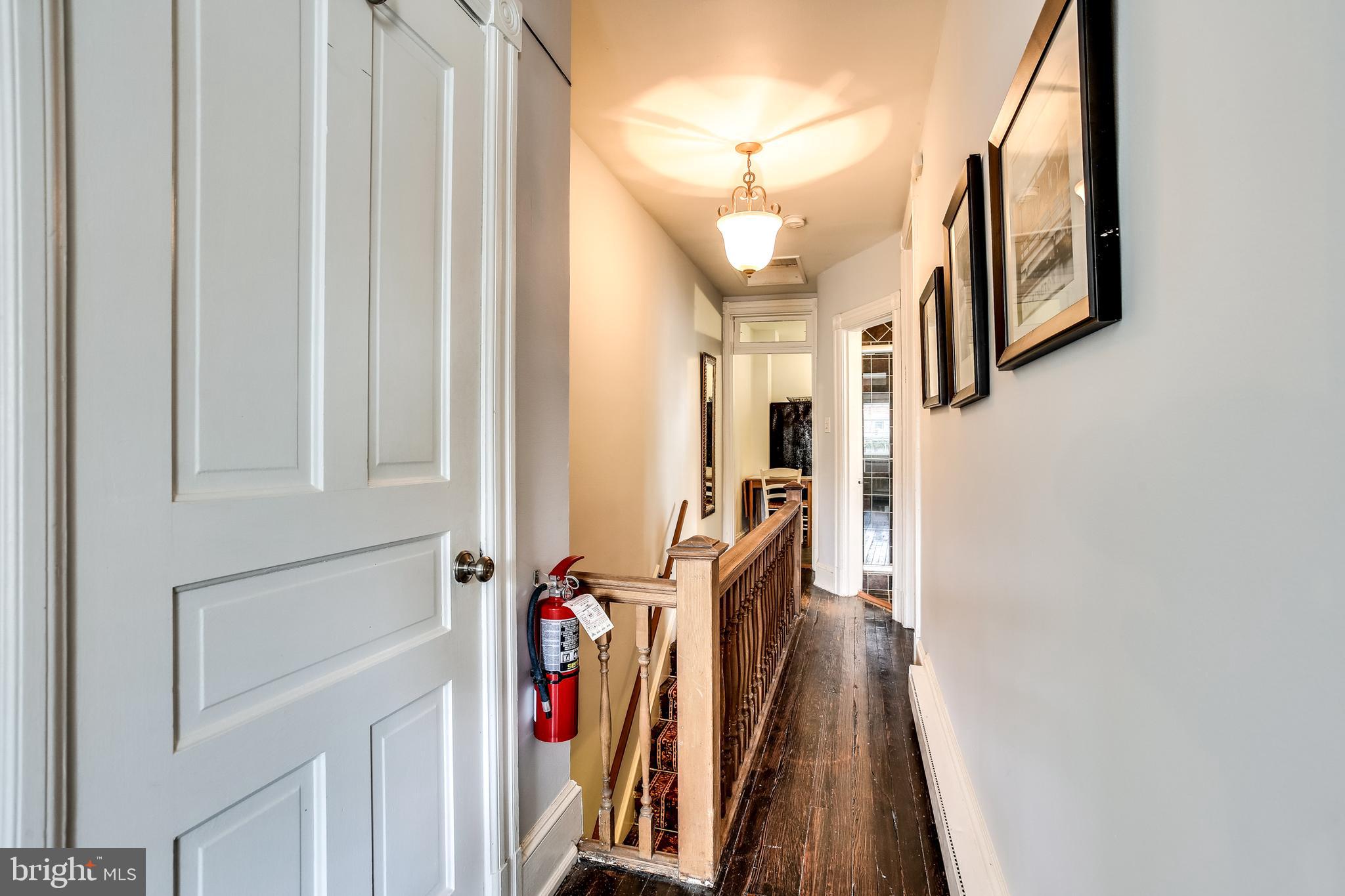 1211 33rd Street Northwest, Unit 2 Washington, DC 20007 - Photo 11 of 23 a view of a hallway with wooden floor and staircase