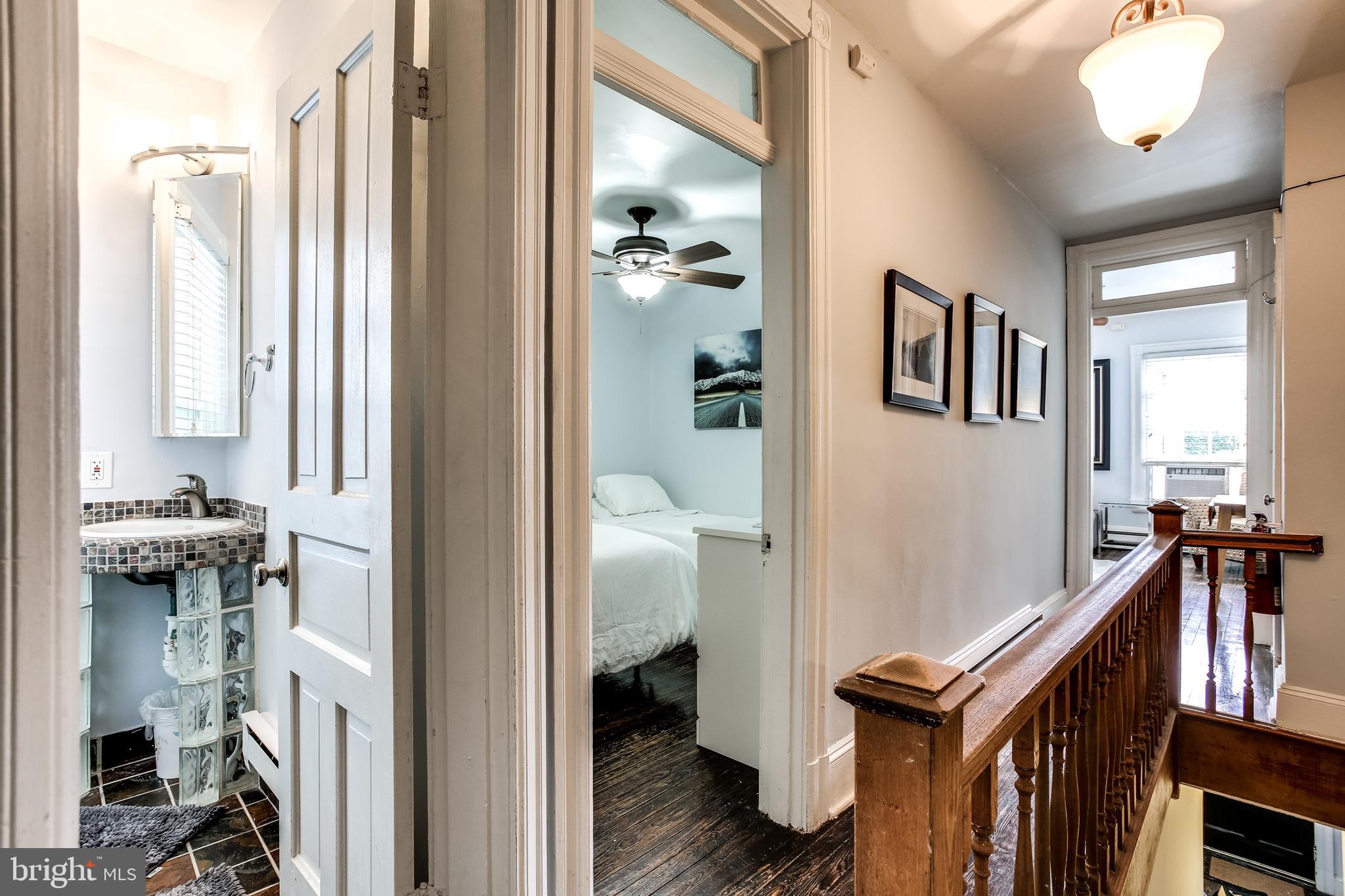 1211 33rd Street Northwest, Unit 2 Washington, DC 20007 - Photo 12 of 23 a view of a hallway with living room and wooden floor