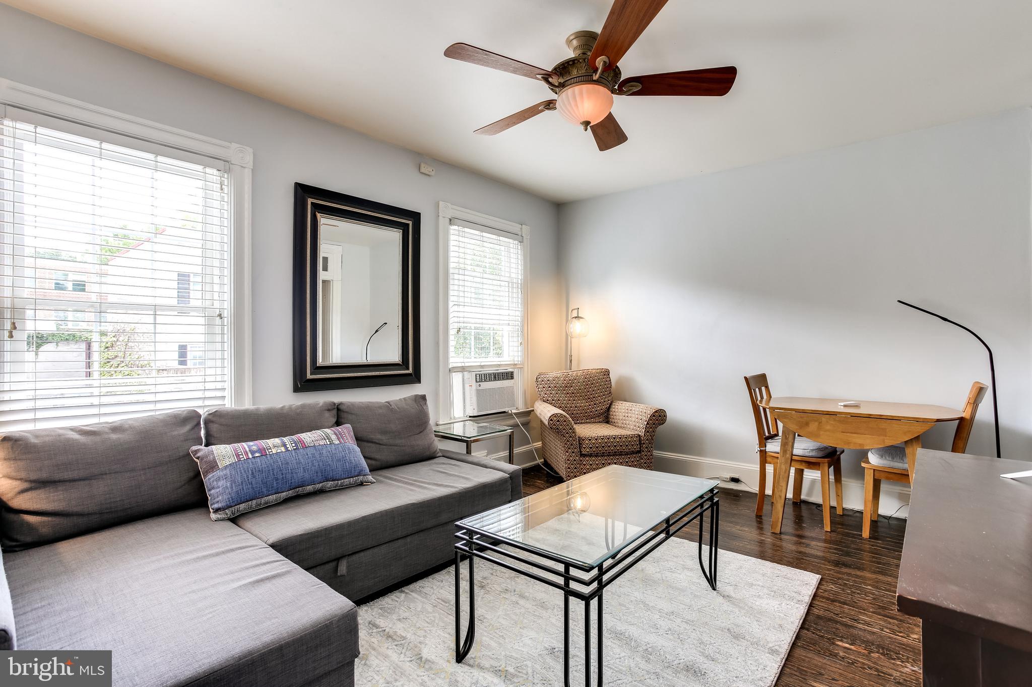 1211 33rd Street Northwest, Unit 2 Washington, DC 20007 - Photo 7 of 23 a living room with furniture and a window
