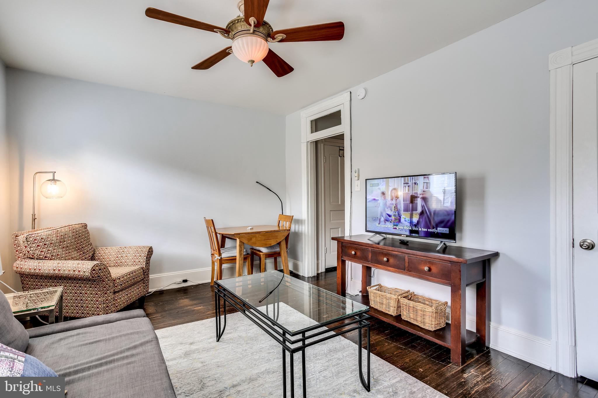 1211 33rd Street Northwest, Unit 2 Washington, DC 20007 - Photo 9 of 23 a room with furniture and a flat screen tv