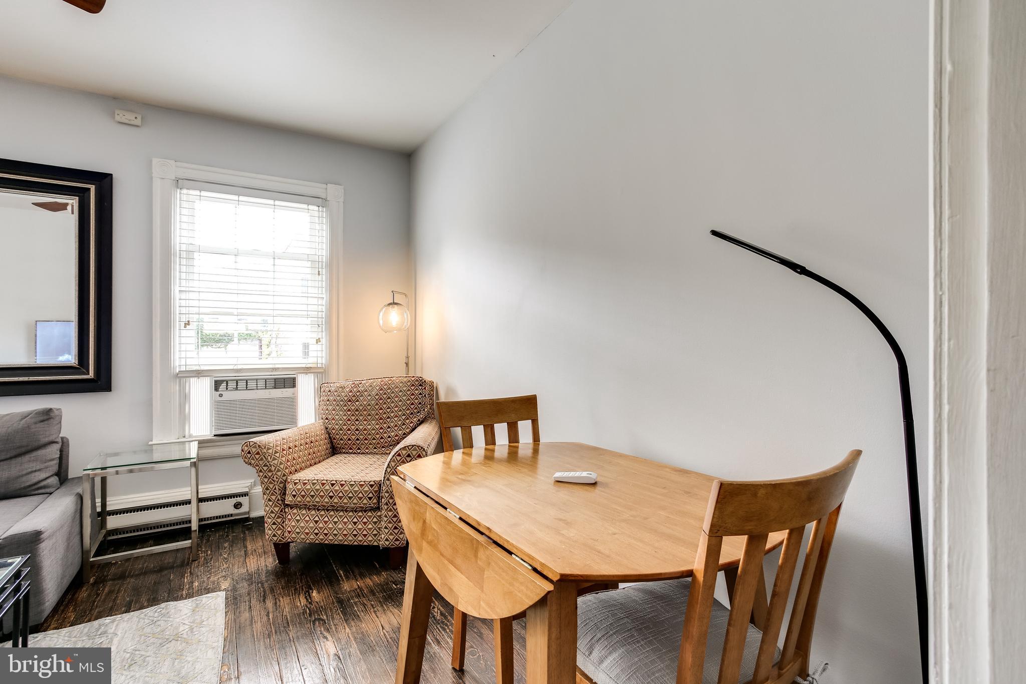 1211 33rd Street Northwest, Unit 2 Washington, DC 20007 - Photo 10 of 23 a living room with furniture and wooden floor