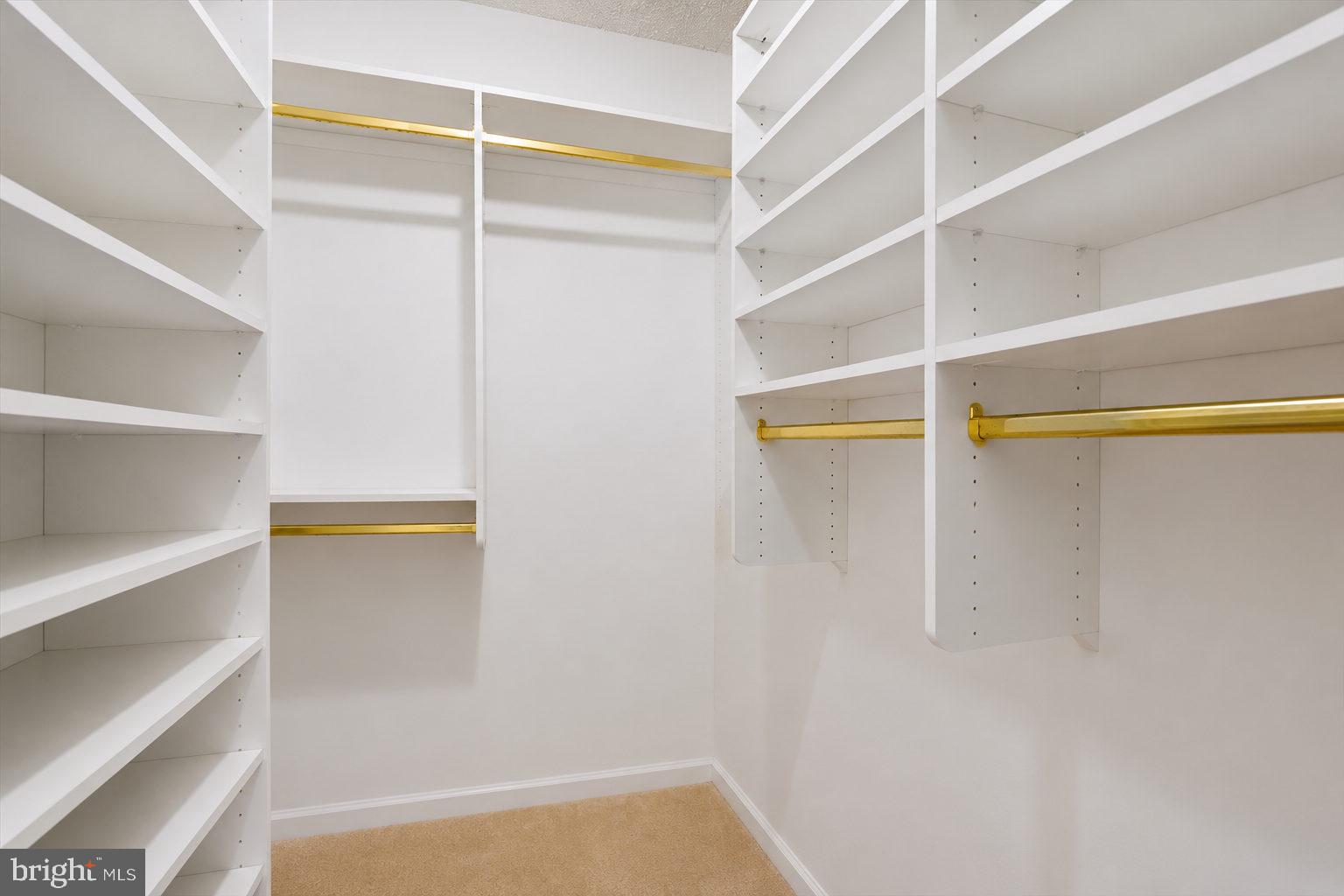 800 25th Street Northwest, Unit 504 Washington, DC 20037 - Photo 38 of 52 Spacious, elegant closet with gold accents.