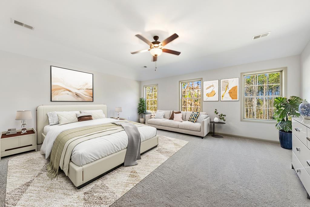 331 Lee Road 0357 Valley, AL 36854 - Photo 15 of 30 a spacious bedroom with a bed and a couch