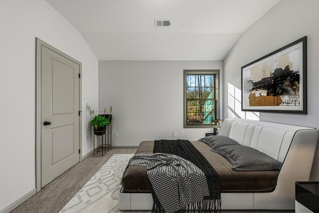 331 Lee Road 0357 Valley, AL 36854 - Photo 22 of 30 a bedroom with a large bed and a window