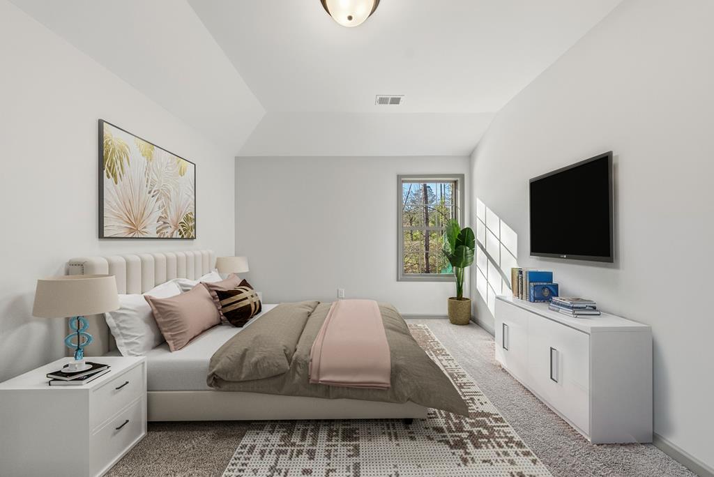 331 Lee Road 0357 Valley, AL 36854 - Photo 26 of 30 a bedroom with a bed and a flat screen tv