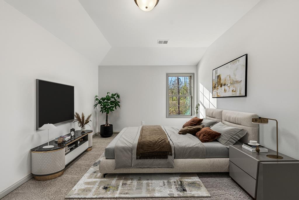 331 Lee Road 0357 Valley, AL 36854 - Photo 27 of 30 a bedroom with furniture and a flat screen tv