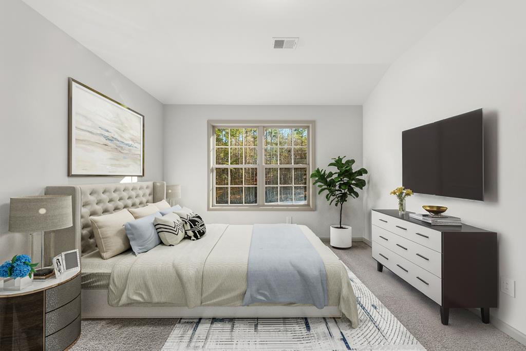 331 Lee Road 0357 Valley, AL 36854 - Photo 28 of 30 a bedroom with a bed and a flat screen tv