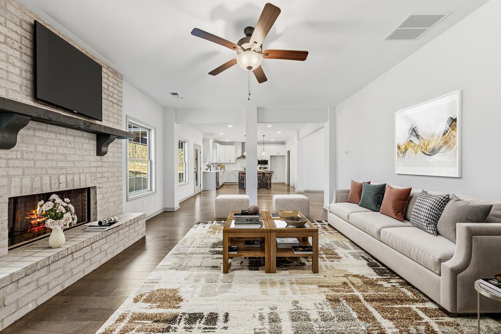331 Lee Road 0357 Valley, AL 36854 - Photo 9 of 30 a living room with furniture fireplace and a flat screen tv