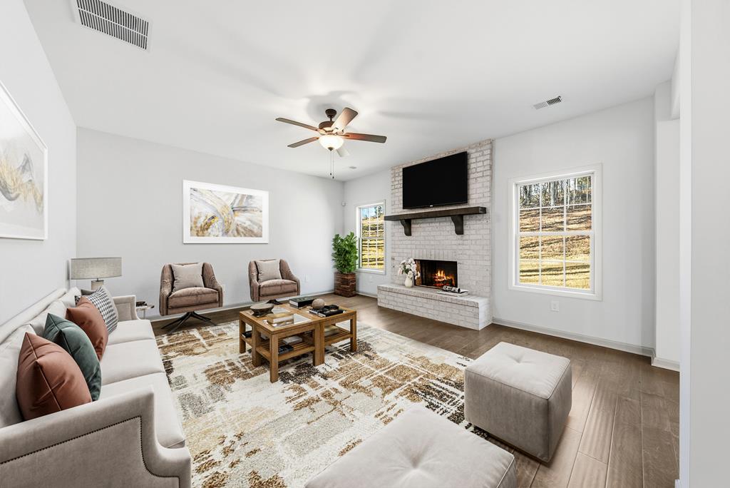331 Lee Road 0357 Valley, AL 36854 - Photo 10 of 30 a living room with furniture fireplace and a flat screen tv